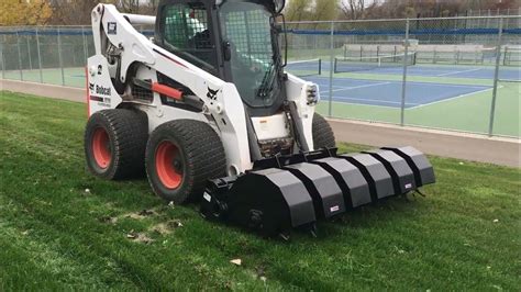 caterpillar skid steer attachment|caterpillar skid steer aerator attachment.